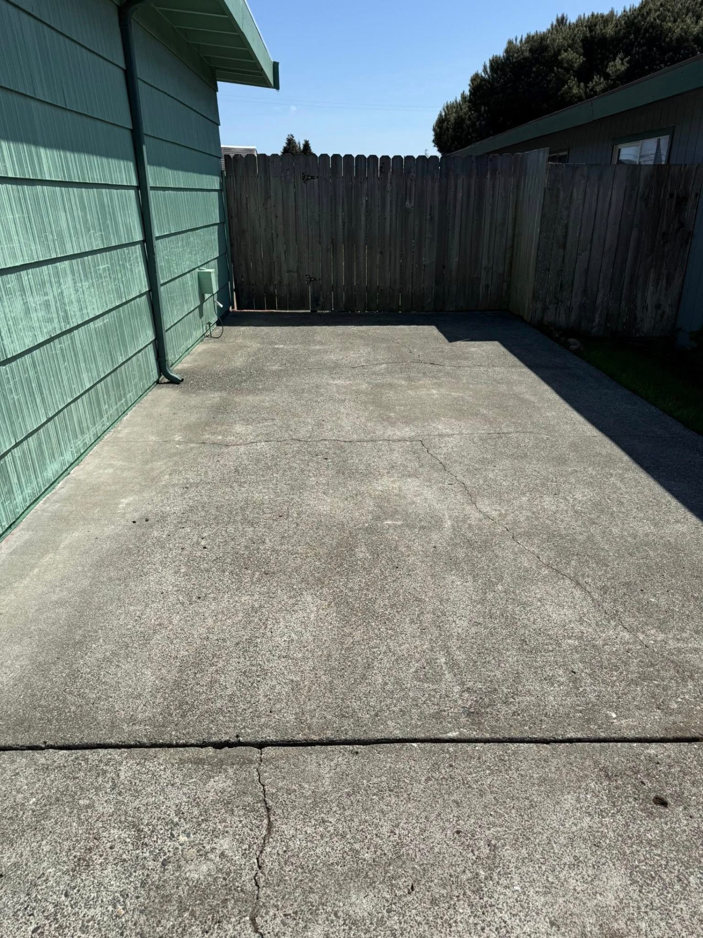 Pressure washing concrete patio in Humboldt County